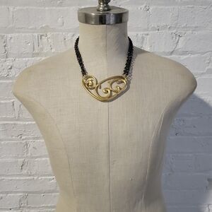 Elegant Gold and Black Heart Necklace